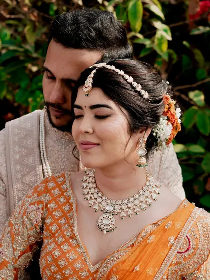 A romantic close-up of the bride and groom. Reeya's copper-hued eyes and fresh skin look stunning next to her partner.