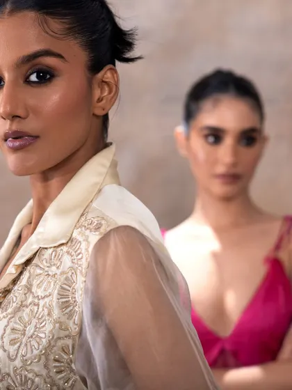 An interesting composition for Akashi Clothing where the makeup on both models is visible. The looks are cohesive, featuring a modern smoky eye that suits the brand's aesthetic.