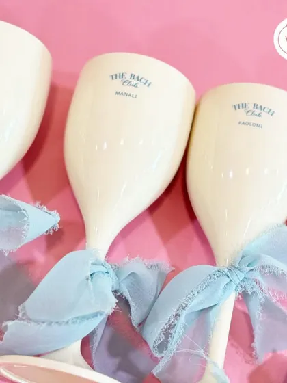 Custom wine glasses for "The Bach Club," perfect for toasting the bride-to-be during her bachelorette party in Manali.
