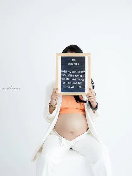 A fun and relatable take on the third trimester. This creative shot with a letter board adds a touch of humor and personality to the maternity session.