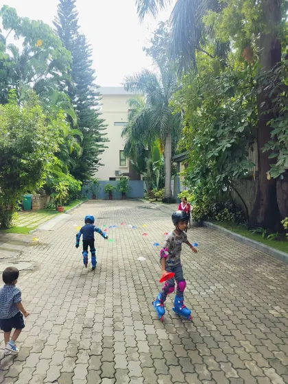 Kids skate down a paved path, enjoying the feeling of freedom and movement. Our classes help children become comfortable and confident in navigating different outdoor environments on their skates.