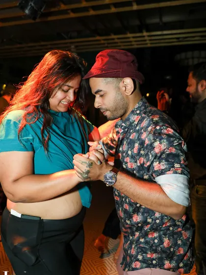 A close-up of two dancers in a sensual Bachata hold, showcasing the connection and trust that develops in our dance community.