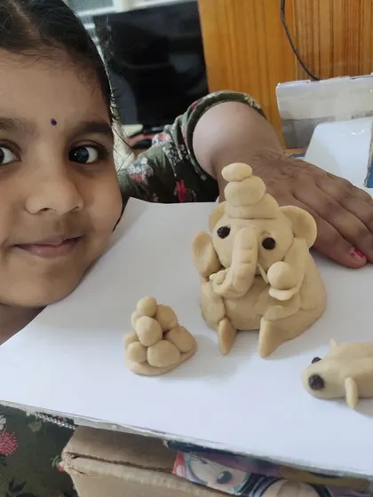 This student's clay sculpture is a testament to her ability to work with her hands to create a three-dimensional form.