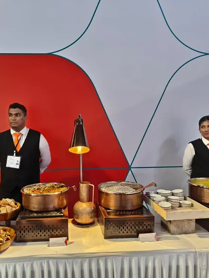 A hot food station at the Air India event, with our professional staff ready to serve guests. We use stylish copper pots and modern equipment to ensure food is served at the perfect temperature.
