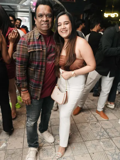 Posing with a fan at our midweek party.