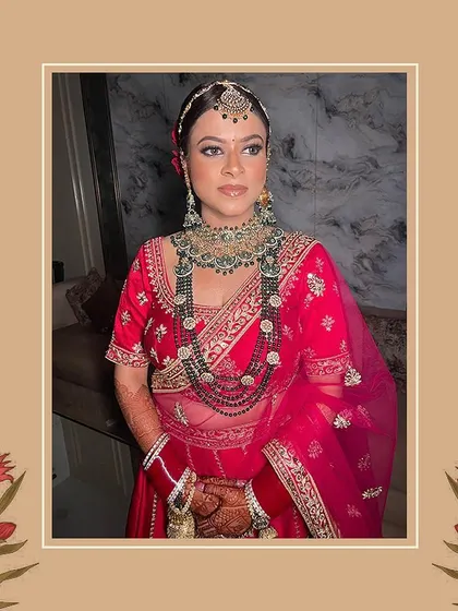 A beautiful bride ready for her big day. This classic red lehenga with heavy golden embroidery and layered necklaces creates a timeless and regal bridal look that we were honored to help create.