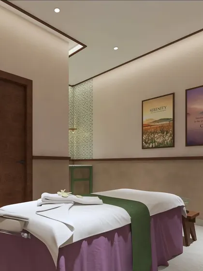 This treatment room is designed for tranquility and function. The layout provides ample space for the therapist to work, while the soft lighting and serene artwork help the client relax completely.