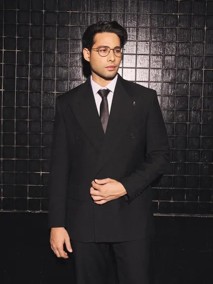 The full effect of Siddhant Chaturvedi's custom suit. The clean lines and monochrome palette create a look that is both sophisticated and contemporary.