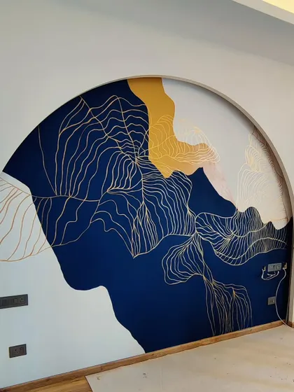 Another angle of the abstract arch mural, showing how the gold linework flows across the different colored sections, creating a sense of movement.