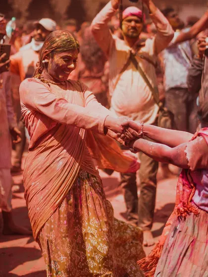 A vibrant collection of images from the Holi celebrations in Braj, specifically Nandgaon. This series captures the pure ecstasy of the festival, with portraits of devotees, men dressed as gopis, and crowds dancing in a cloud of colors.