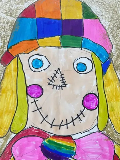 A colorful and friendly scarecrow portrait. This piece showcases a student's ability to use bright colors and assemble a face using various shapes and textures.