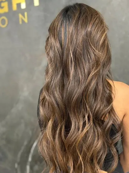 A side view of the gypsy soul balayage, showing its length and flow.