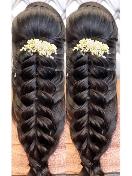 A clean and simple open hairstyle with a beautiful pulled braid.