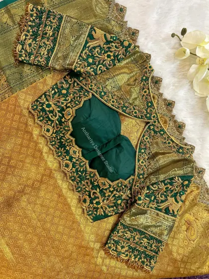 The back of the green blouse, featuring an intricate cutout design.