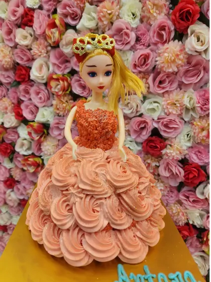A beautiful doll cake where the doll's dress is made entirely of piped buttercream frosting. This classic design is always a favorite for a little girl's birthday.