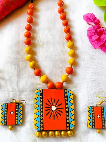 An orange and yellow version of the rectangular pendant set, full of warmth and energy.