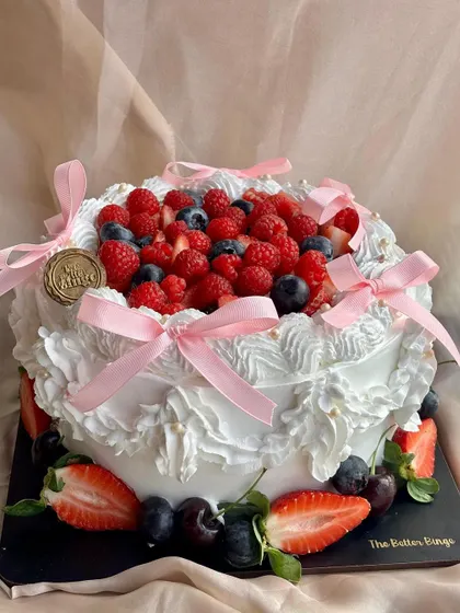 Another angle of our beautiful Vanilla & Berries cake. The combination of light vanilla sponge and tart berries is a crowd-pleaser for any event.