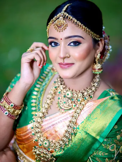 The complete bridal look, with the saree, custom blouse, and traditional jewelry all coming together perfectly.