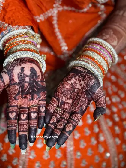 The final stain is the most important part. This photo shows the deep, rich maroon color my natural henna achieves, featuring detailed couple portraits that look stunning against the dark stain.