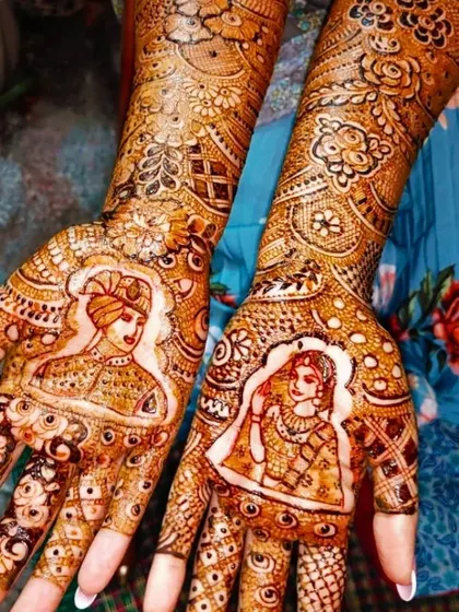 A close-up view of bride and groom portraits on the palms. I take great care to capture the details of the bridal attire and expressions to make the figures come alive.