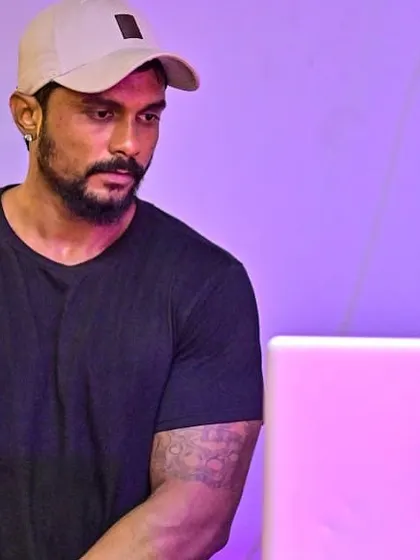 Another candid moment, focused on selecting the next track.