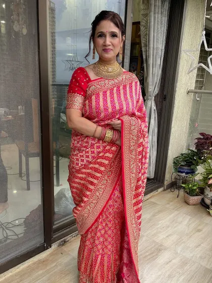 The full look for this elegant client. The makeup is refined and beautiful, perfectly complementing her traditional attire.