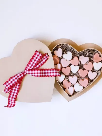 This heart-shaped box is filled with cute little facial bomb soaps. It's a perfect example of the beautiful and thoughtful gift hampers I can create for any occasion.