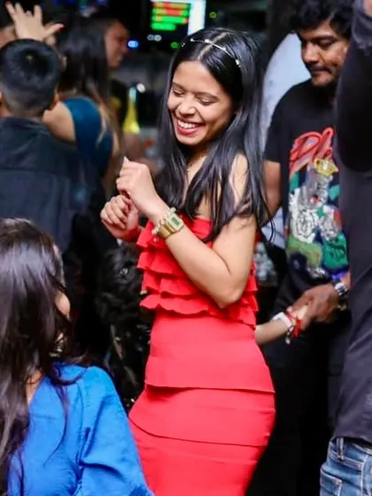 Another happy dancer enjoying the desi and videsi tunes at Tipsy Bull.