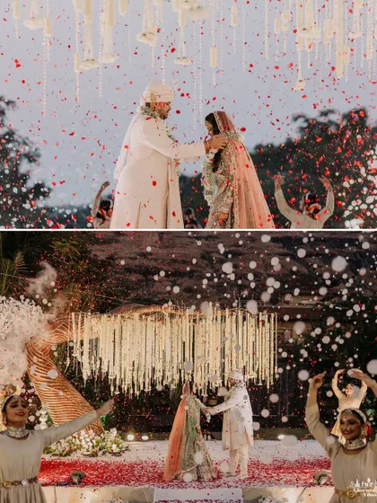 The varmala exchange, made even more magical with a shower of red petals and a backdrop of graceful dancers. I coordinate these elements to turn a ritual into a spectacular performance.