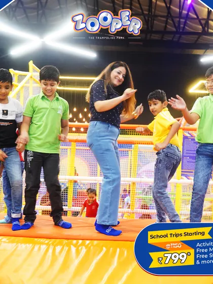 The teacher-student bond gets stronger when you are having fun together. Here, a teacher joins her students for a dance on the trampolines.