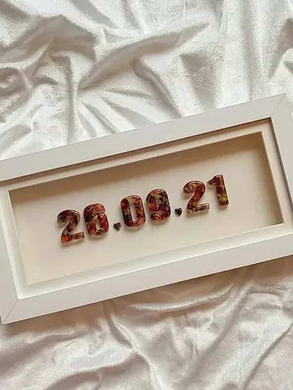 A full view of the minimal date frame, perfect for any decor style. It's a subtle yet meaningful reminder of a cherished day.