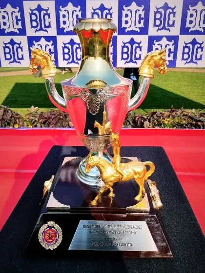 The Madras Race Club Trophy, an ornate silver cup with horse-head handles, symbolizing the inter-club racing tradition.