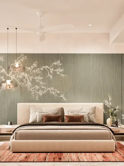 A render for a serene master bedroom in a Mumbai home. The design features a textured green wall with delicate cherry blossom art, paired with soft, earthy tones and modern pendant lights.
