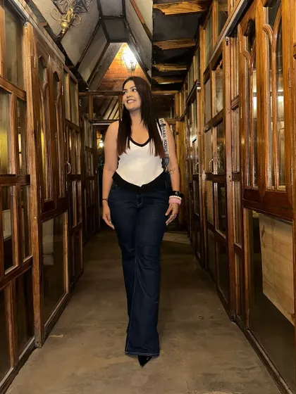 The V-shape waistline of these jeans is a unique detail that adds a modern touch to a classic silhouette.