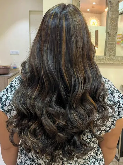 This is a global hair color with added highlights for depth. The combination of an all-over color with strategically placed lighter pieces creates a rich, dimensional look that is perfect for adding volume and interest to long hair.