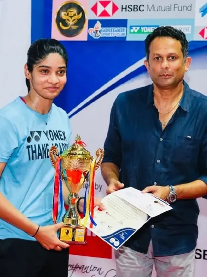 Chief Guest Gaurav Natekar presenting the trophy to a winner in the women's category, highlighting the talent at the tournament.