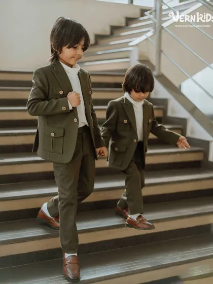 The bond between brothers is special, and we love creating outfits to match. Here, two brothers wear our custom-designed olive green shacket sets, featuring functional pockets and a comfortable fit, perfect for making memories together.
