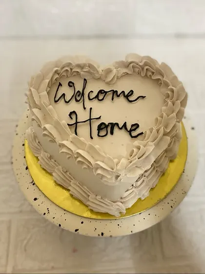 A piece of our heart, for you to celebrate. This heart-shaped Belgium chocolate cake with vintage ruffles is perfect for a "Welcome Home" celebration.