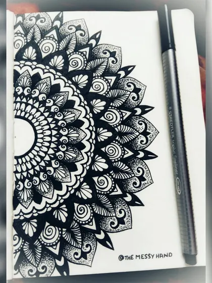 A half-mandala drawn in my sketchbook. Sketchbooks are where I practice new patterns and let ideas flow freely.
