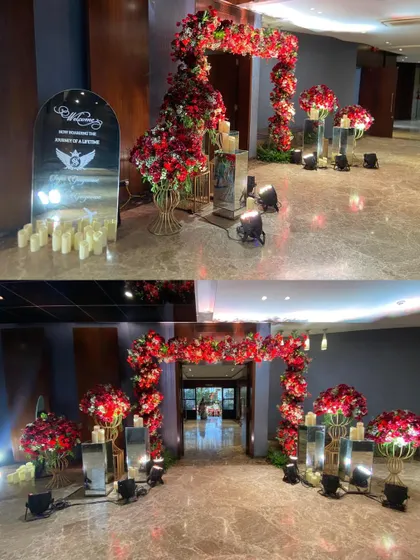 A collage showing the welcome area for a grand event, featuring a personalized mirror sign, candle-lit pathway, and a magnificent red floral arch.