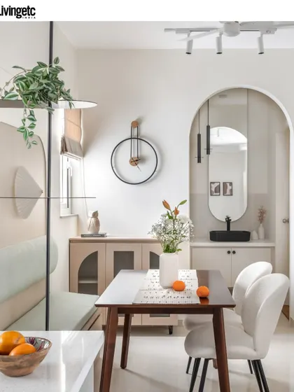 This dining nook and wash basin area, featured in Livingetc, demonstrates my skill in creating functional beauty in every corner. The arched entryway and modern furniture create a cohesive and stylish vignette.