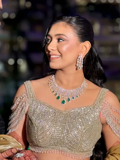 A happy, candid moment between the couple, with the bride's radiant makeup shining through.