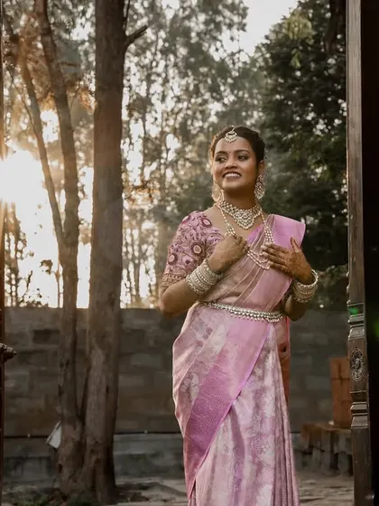 A bride basking in the golden hour glow. We chase beautiful light to create artistic portraits like this one of Aishwarya, capturing her radiance and joy as she steps into a new beginning at The Peacock Grove.