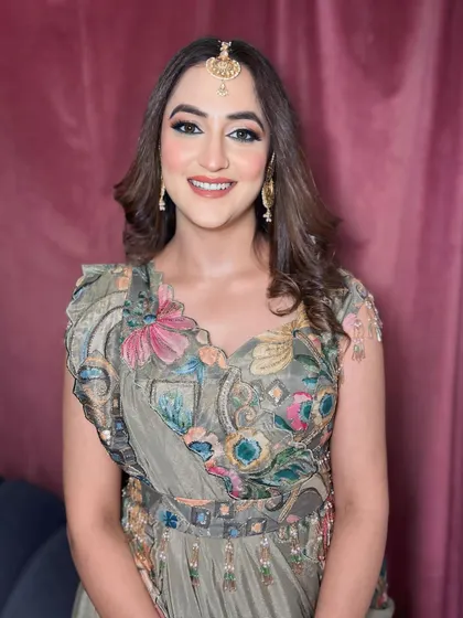 A full view of this lovely guest makeup. The soft waves and radiant makeup create a look that is both effortless and chic.