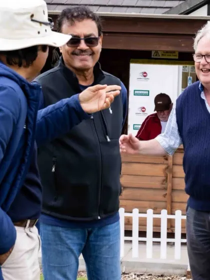 Pointing out a technical detail during a conversation with Rashid Patel. I am always observing and analysing the game, looking for insights to pass on to the players.