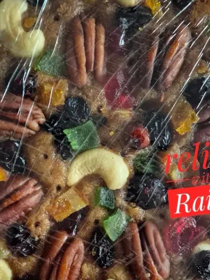 This is a close-up of my traditional Christmas plum cake. You can see how it's loaded with premium nuts like pecans and cashews, and a variety of fruits that I soak for months in rum for that authentic, rich flavour.