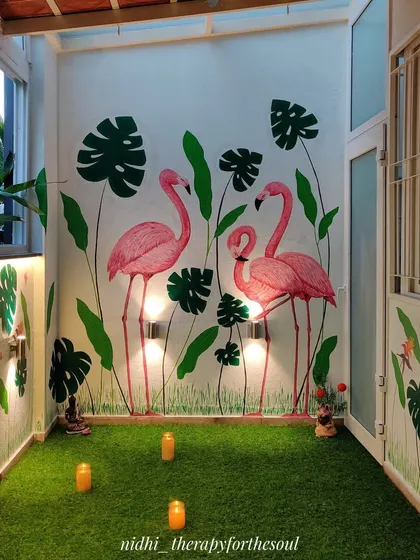 This balcony became a vibrant tropical escape with a hand-painted flamingo mural. It’s a perfect example of how we can bring the outdoors in, creating a fun and inviting space for family gatherings or a quiet evening.