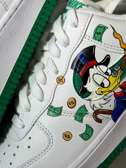 A macro shot of the Scrooge McDuck artwork on the custom AF1s.
