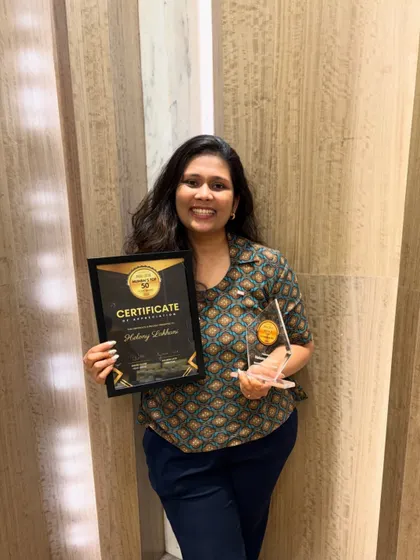 A duplicate of image 14, showing me proudly holding my certificate and trophy for being named one of Mumbai's Top 50 Bakers.