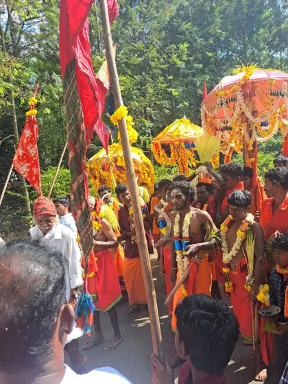 The 'ganacharis' or priests, possessed by the spirit, leading the procession with intense energy.